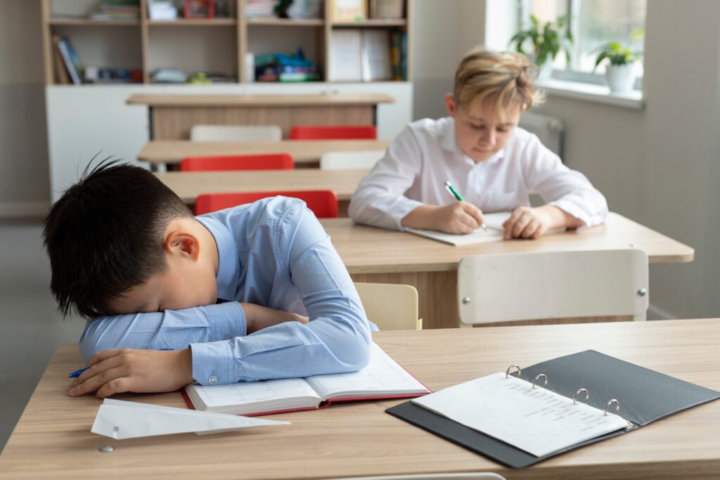medium shot kid sleeping school 1