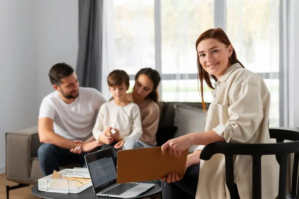 medium shot smiley therapist with family 1